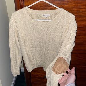 Beige knit sweater with faux leather elbow pads